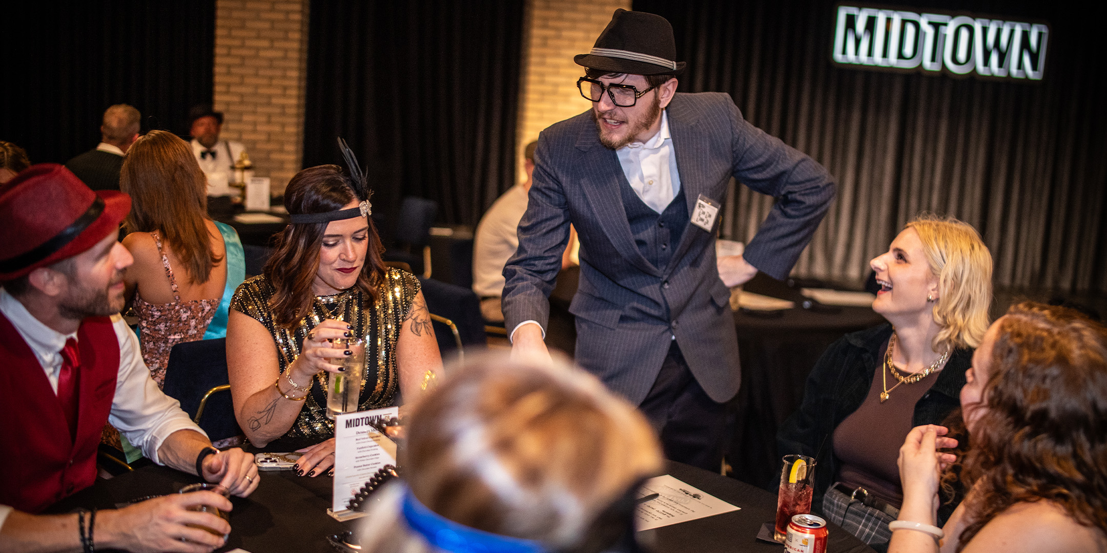 Guests at a Murder Mystery Company public dinner show in Dallas